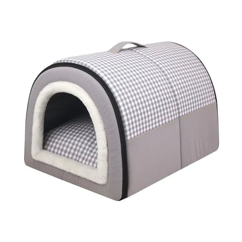Indoor dog house bed in grey with a grey gingham roof, a white plush arched door and a carry handle