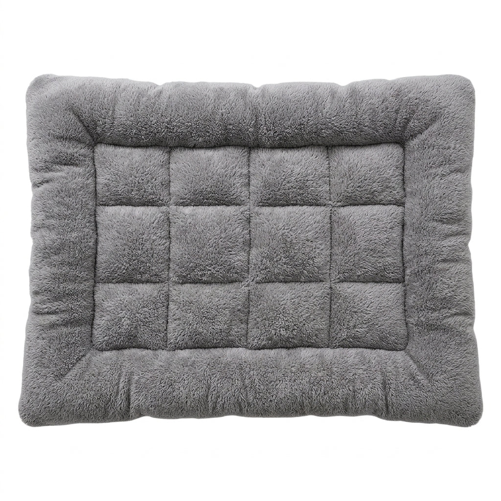 Kennel bed for dogs in grey plush, a rectangular crate mat with a padded border and a quilted grid of squares, from above