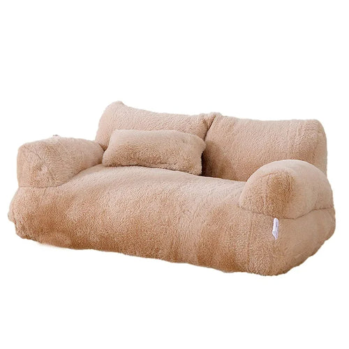 Luxury cat bed in camel plush shaped like a two-seater sofa, with rounded armrests, a split backrest and a small pillow