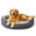 Golden retriever lying in a grey oval donut bed with a textured plush lining, paws over the rim