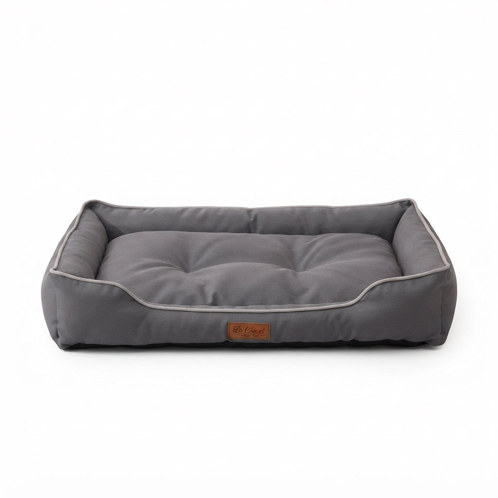 Rectangular Oxford dog bed in grey with pale piping and a low front edge
