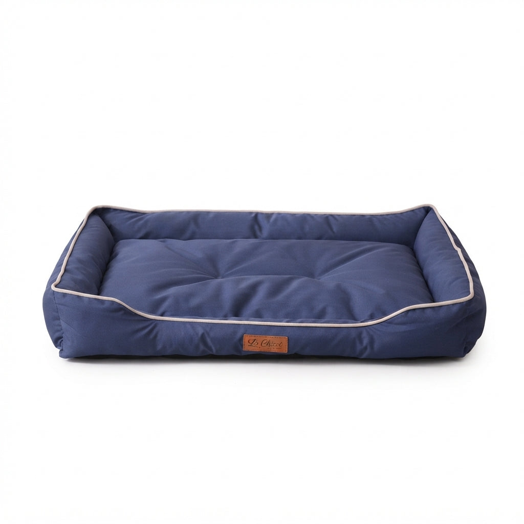 Rectangular Oxford dog bed in navy blue with pale piping and a low front edge