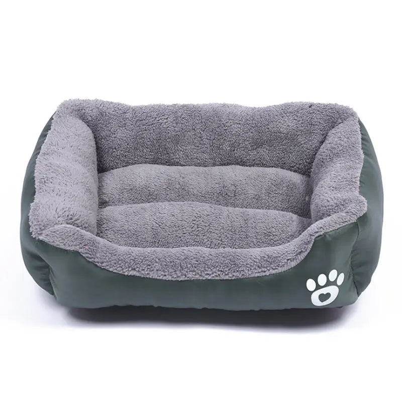Rectangular dog bed in dark green Oxford cloth with a grey plush lining and a white paw print