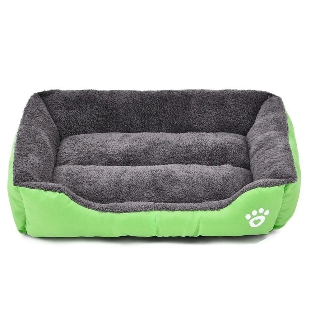 Rectangular dog bed in light green Oxford cloth with a dark grey plush lining and a white paw print