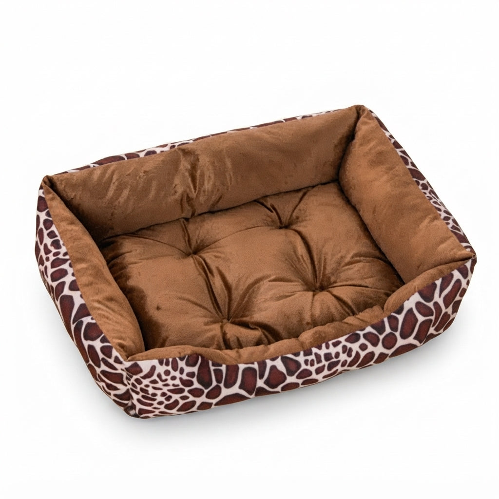 Rectangular dog bed in giraffe print with a brown and cream outer wall and a tufted brown velvet cushion