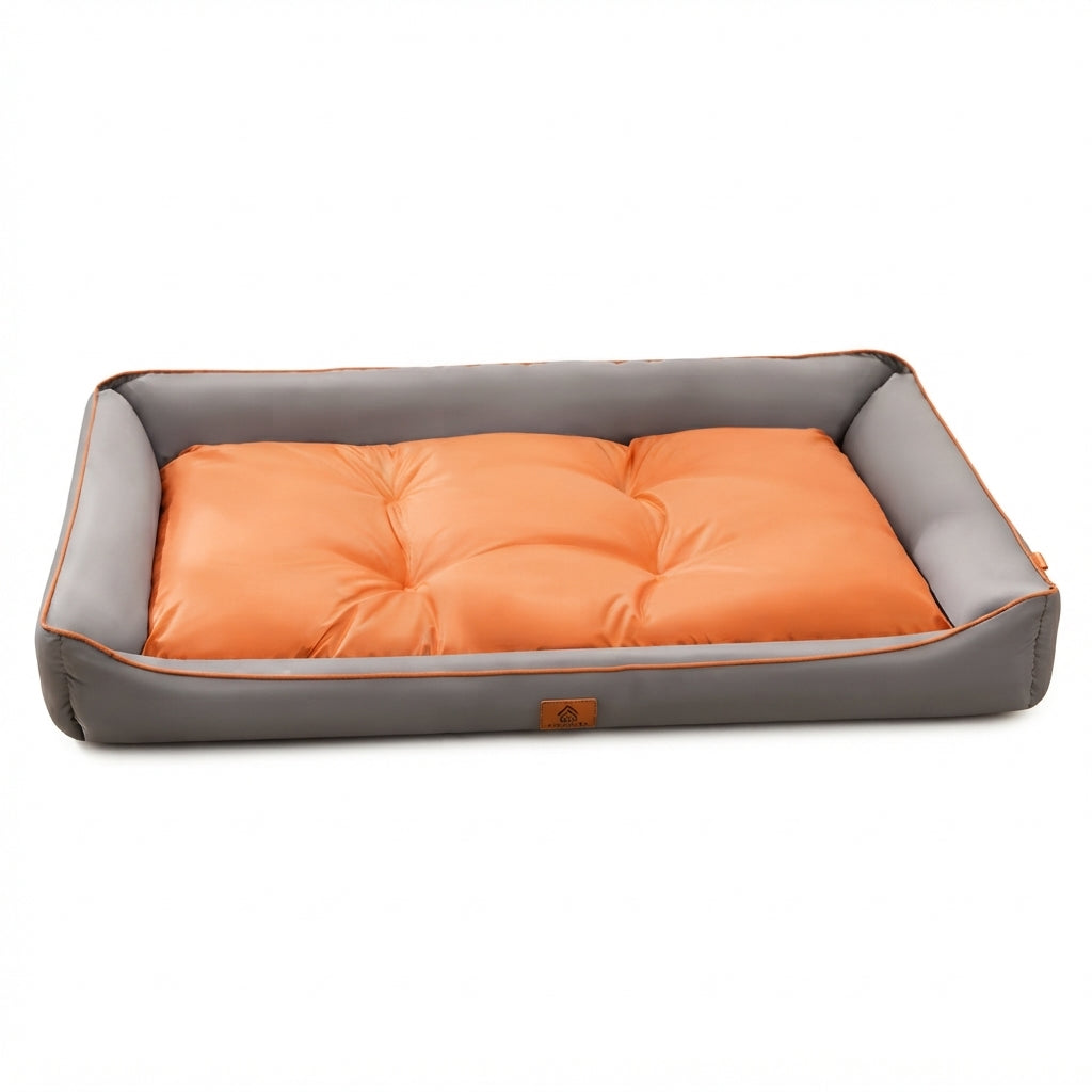 Rectangular dog bed, two-tone grey and orange: a grey frame with a tufted orange cushion and orange piping