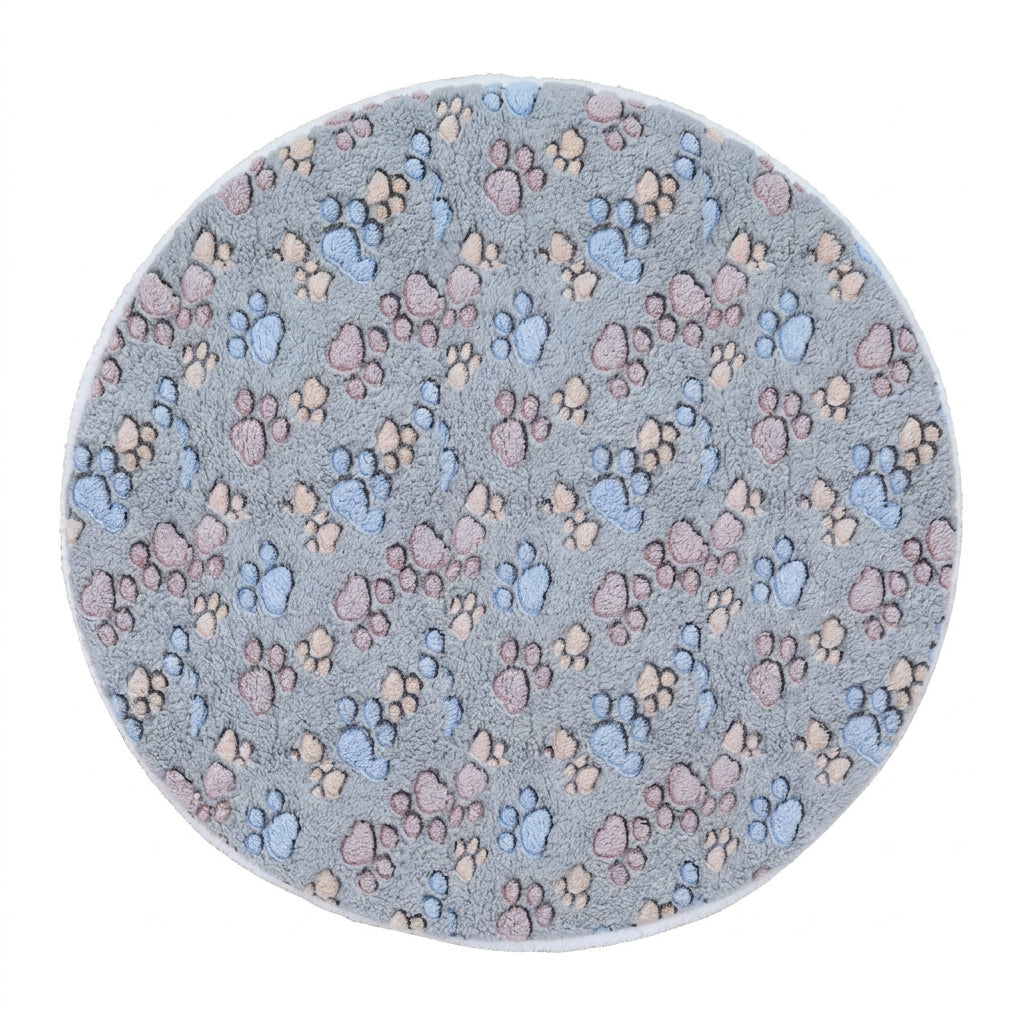 Round cat mat in blue-grey plush printed with blue, pink and beige paw prints, a cream fleece edge showing