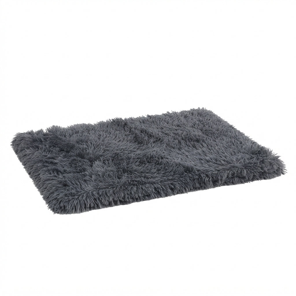 Shaggy dog blanket in dark grey long-pile plush, a flat rectangle seen at an angle