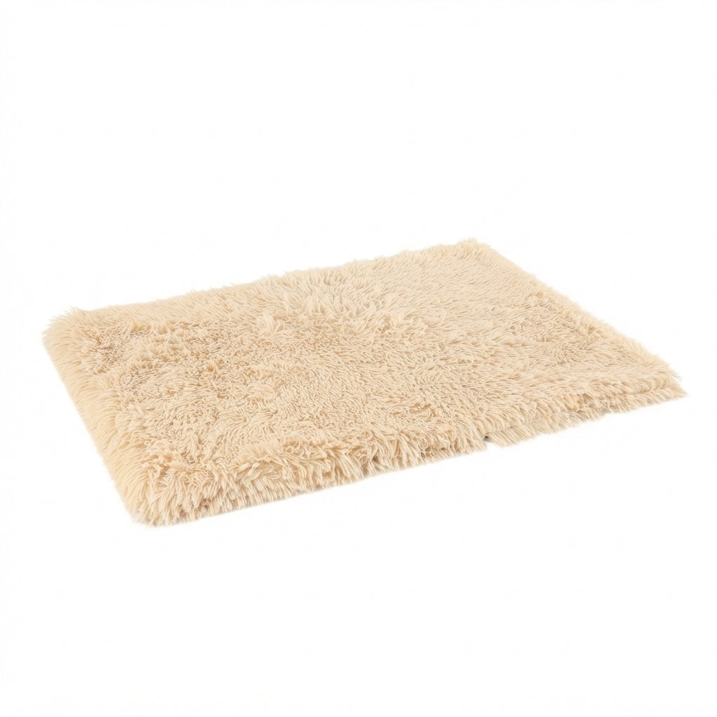 Shaggy dog blanket in sand long-pile plush, a pale beige rectangle seen at an angle