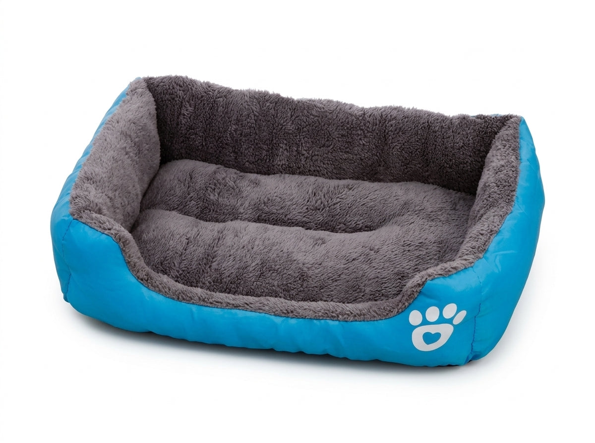 Rectangular dog bed in blue paw design: bright blue fabric sides with a white paw print and a grey plush lining