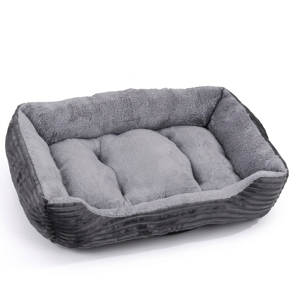 Rectangular dog bed in grey corduroy with ribbed dark grey sides and a light grey plush cushion