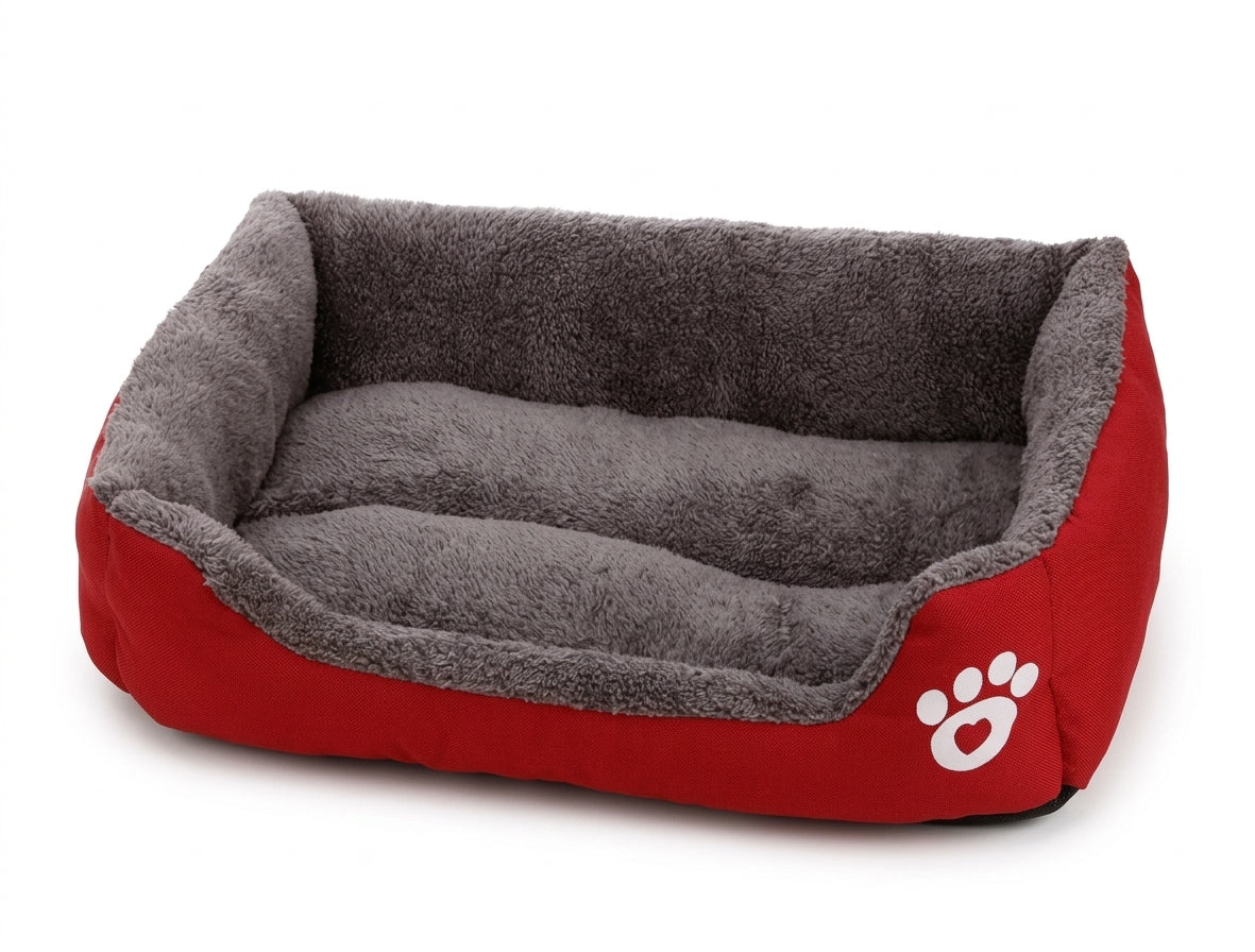 Rectangular dog bed in red paw design: red fabric sides with a white paw print and a grey plush lining