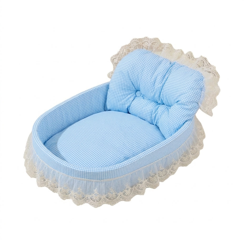 Oval sofa cat bed in blue gingham with a buttoned backrest and a cream embroidered lace skirt
