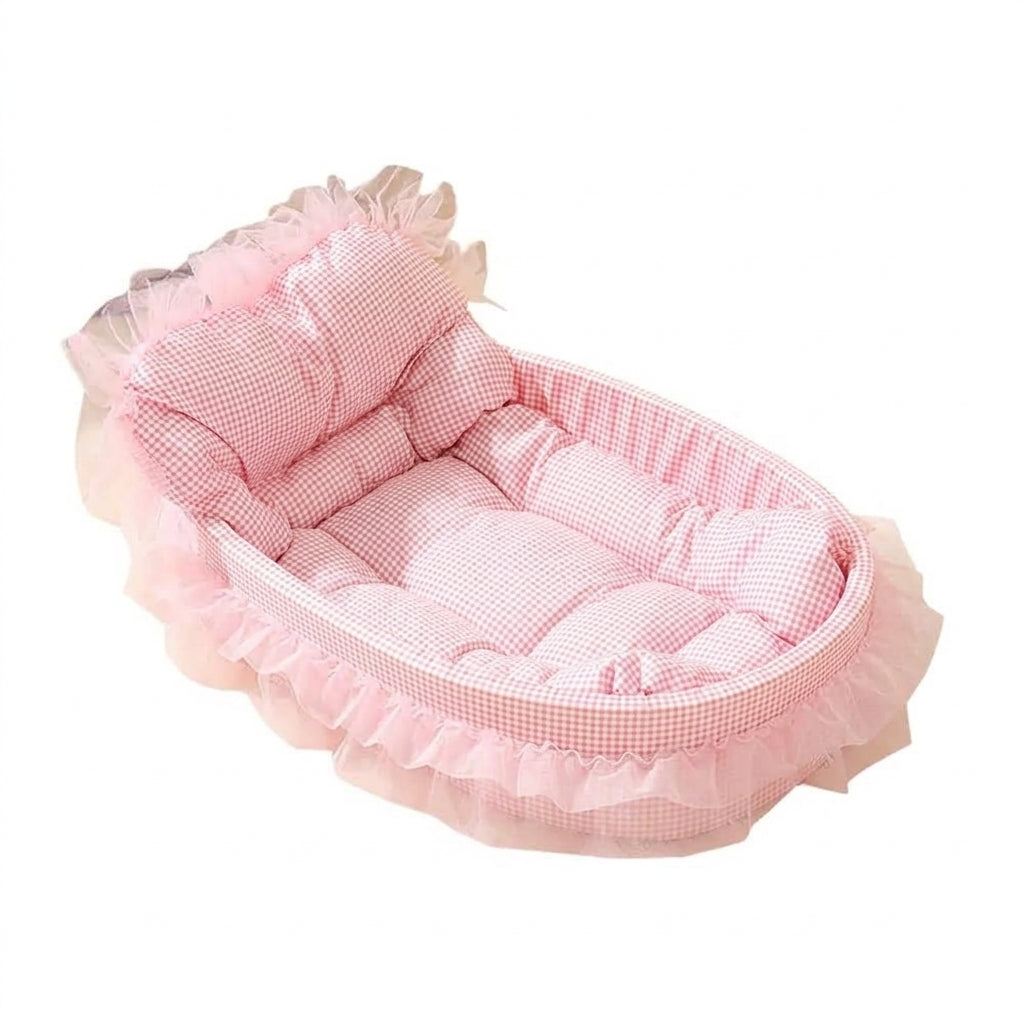 Sofa cat bed with lace skirt in pink gingham, an oval padded base, a raised backrest and layers of pink tulle frills