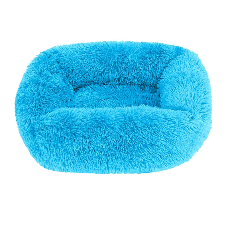 Square dog bed in bright blue long plush, with high fluffy walls around a padded base