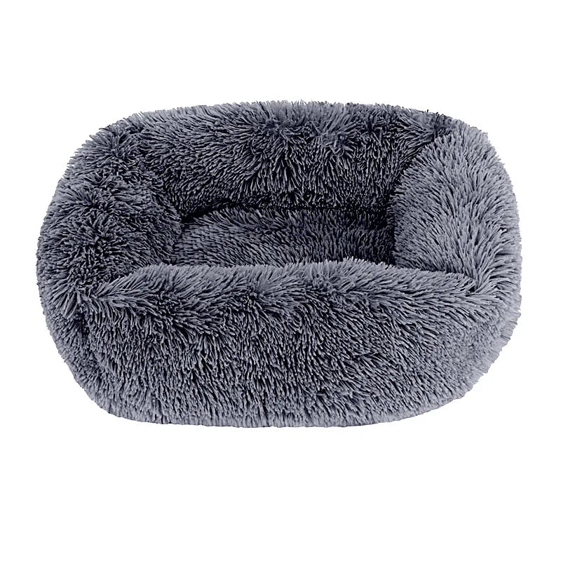 Square dog bed in dark grey long plush, with high fluffy walls around a padded base