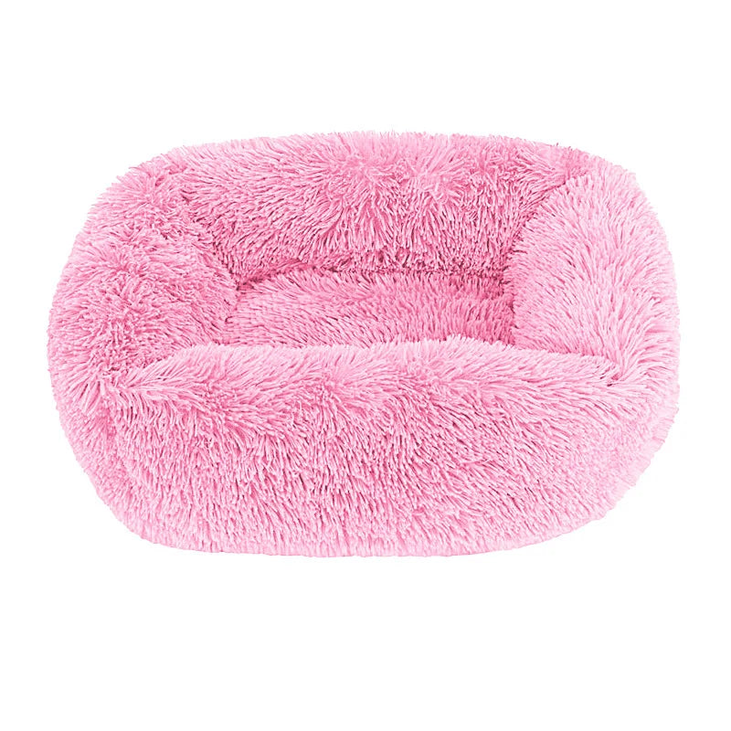 Square dog bed in dark pink long plush, with high fluffy walls around a padded base
