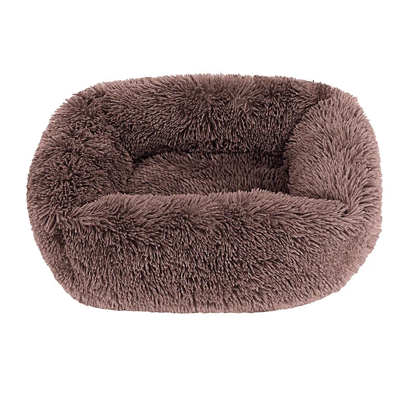 Square dog bed in light brown long plush, with high fluffy walls around a padded base