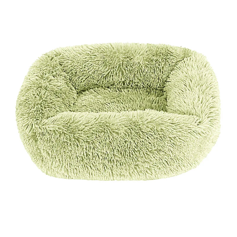 Square dog bed in light green long plush, with high fluffy walls around a padded base