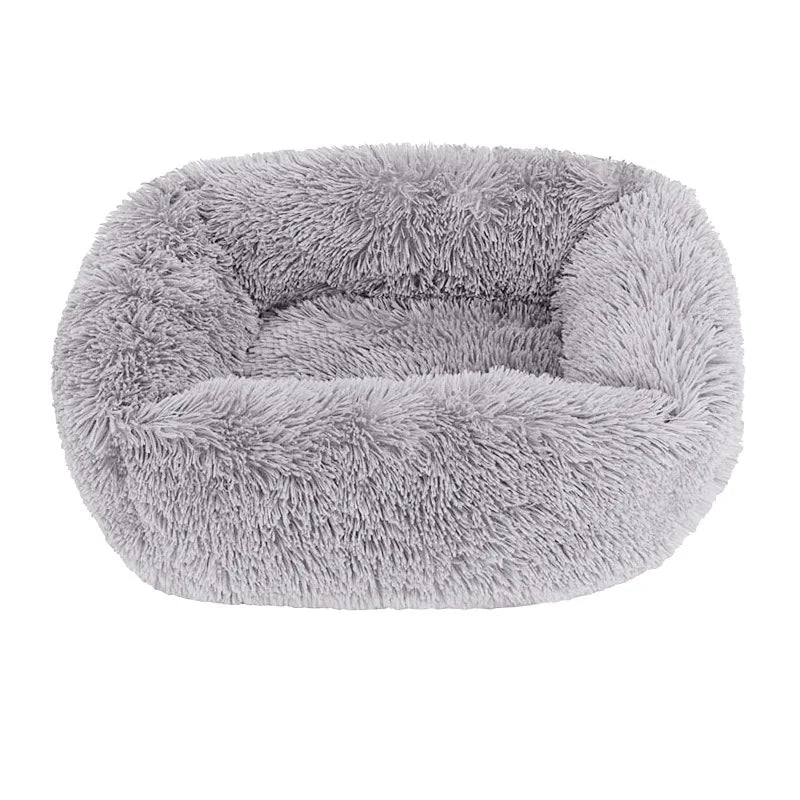Square dog bed in light grey long plush, with high fluffy walls around a padded base