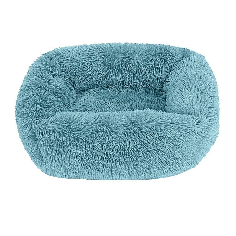 Square dog bed in teal blue-green long plush, with high fluffy walls around a padded base