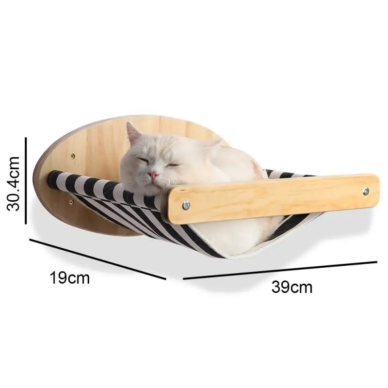 White cat asleep in a black and white striped hammock on a round wooden wall plate, 39 by 19 cm and 30.4 cm high