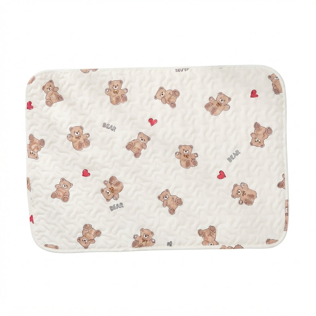 Cream quilted cotton pet mat printed with brown teddy bears, small red hearts and the word Bear