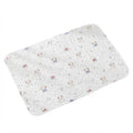 Summer cotton pet mat in white with wavy quilting, printed with small cartoon puppies and the word Smile