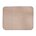 Washable pet mat in light brown with octagon quilted stitching and a matching bound edge, seen from above