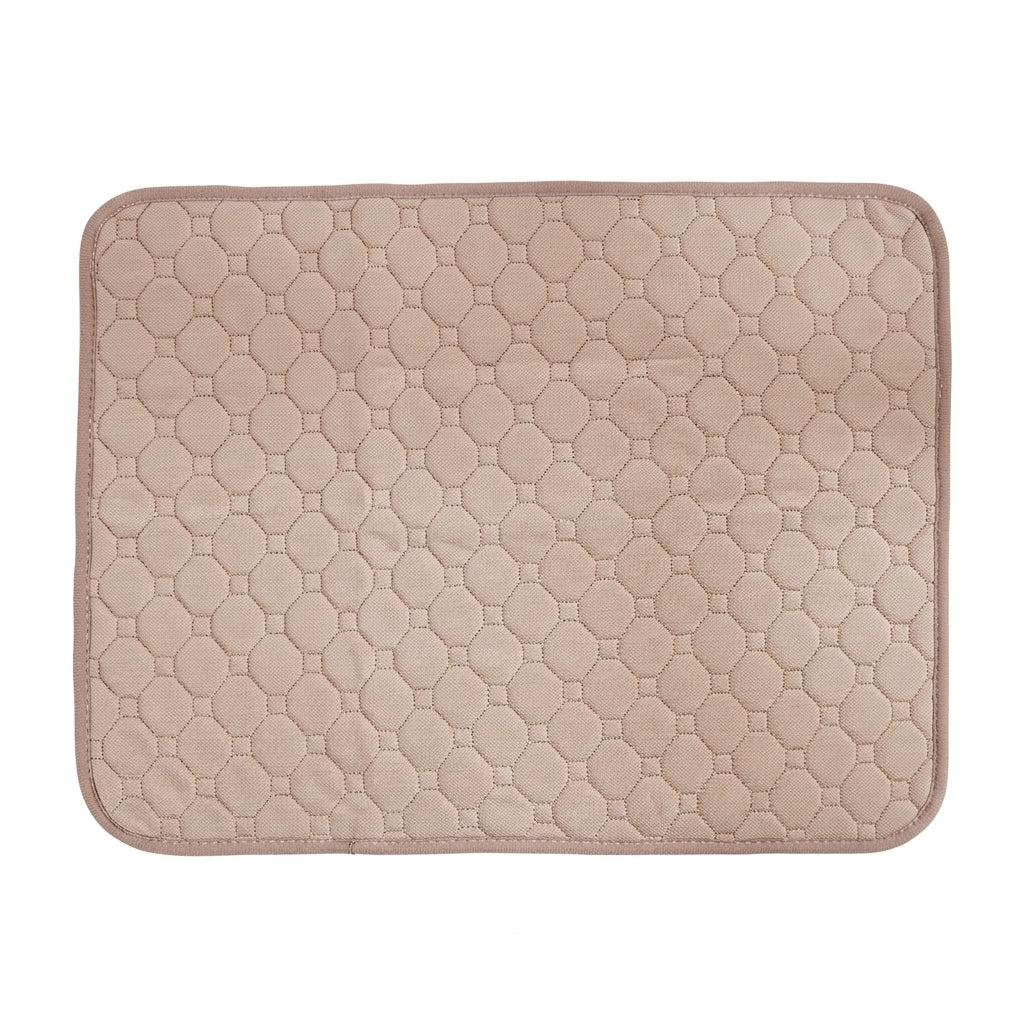 Washable pet mat in light brown with octagon quilted stitching and a matching bound edge, seen from above