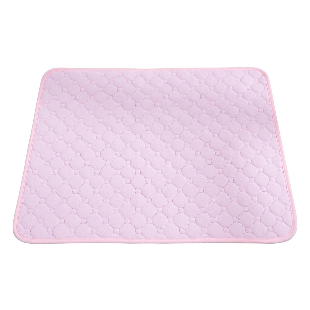 Washable pet mat in pale pink, rectangular with octagon quilting and a pink bound edge, on a white background