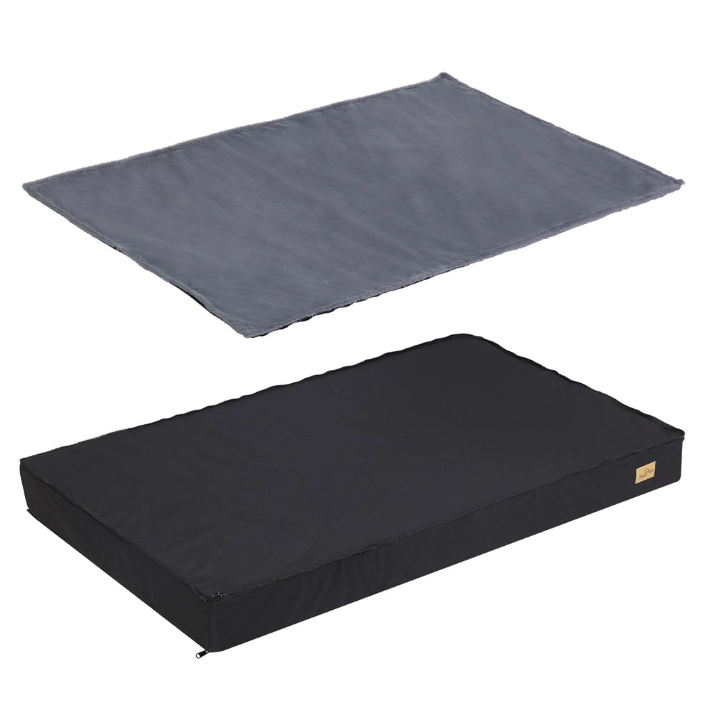 Grey plush cover lifted off the black waterproof foam mattress of the dog bed