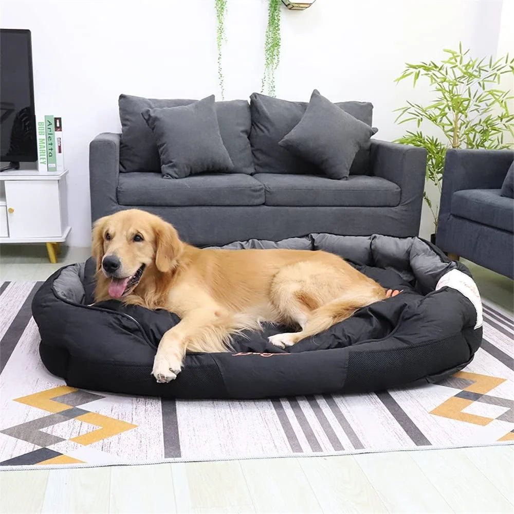 Golden retriever lying in a large black oval Oxford dog bed on a striped rug in a living room